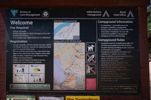 BLM information board at Hittle Bottom showing the fee schedule, a campground map and the campground rules.