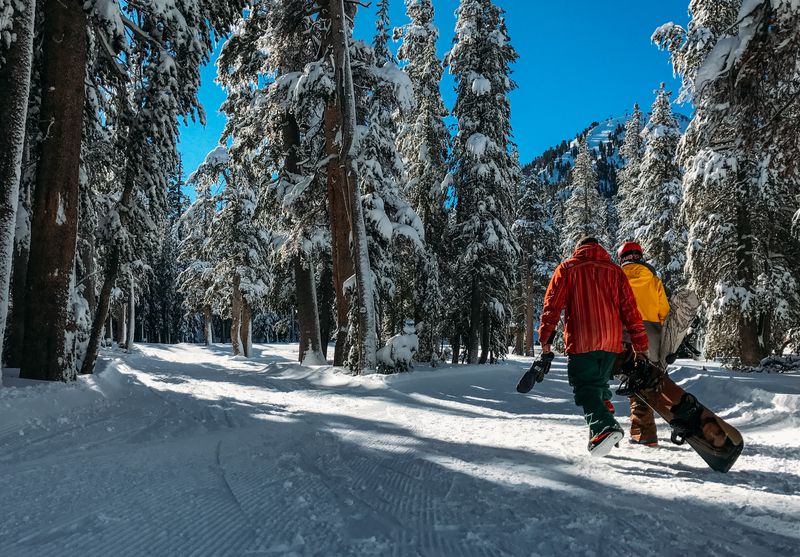 snowboarders hiking