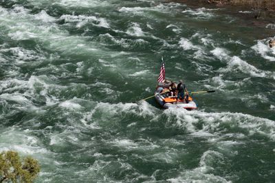 A small boat clearing the wave train below Red Creek Rapid.