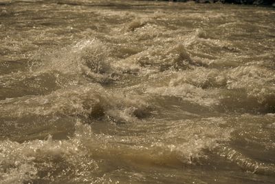 Turbulent whitewater churning through rocks at the approach to Joe Hutch Canyon Rapid.