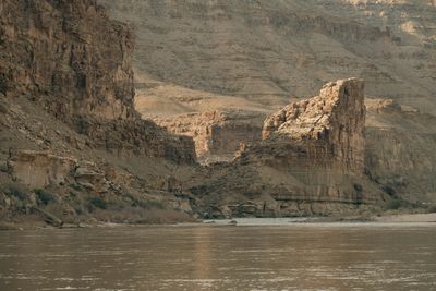 Close view of a sandstone pillar's vertical face and stepped erosion.