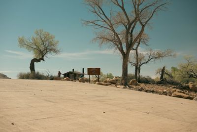 The concrete boat ramp at Swasey's take-out with cottonwoods and the recreation site sign.